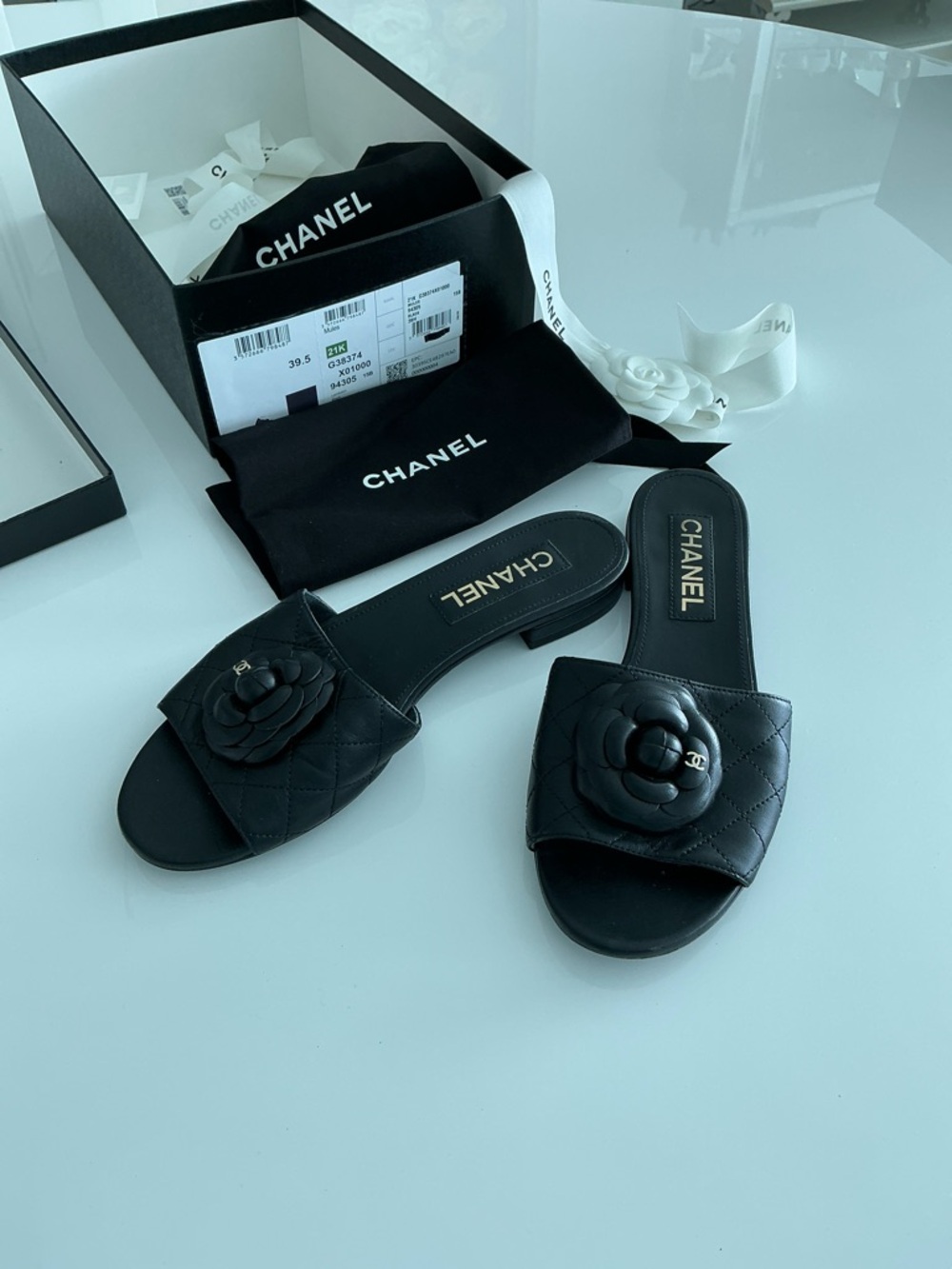 CHANEL Black Quilted Camellia lamb skin  
Mules  size 39 1/2 good condition